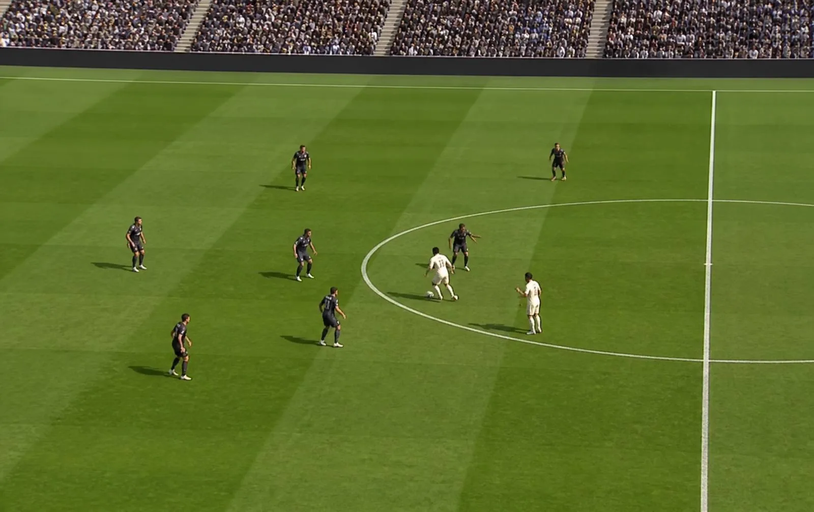 Daylight football match with three defenders closing down the player in possession in midfield