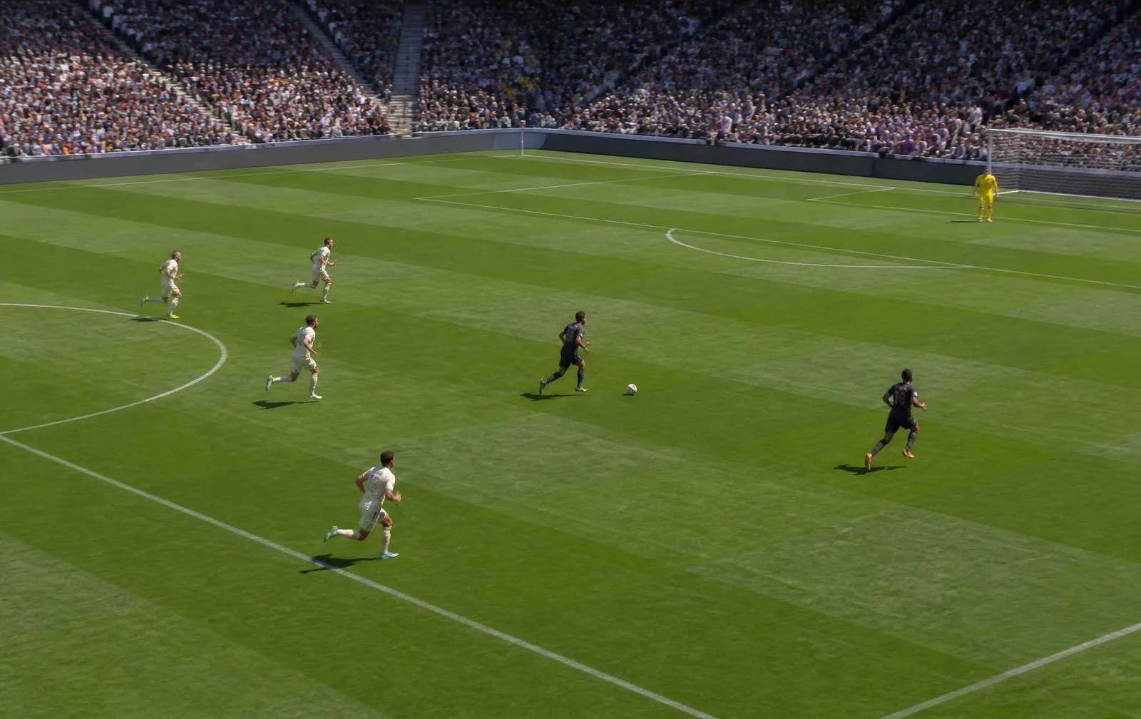 Daylight football counter attack with attackers running into open space ahead of recovering defenders